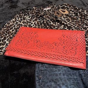 Large brick red laser-cut fold-over clutch